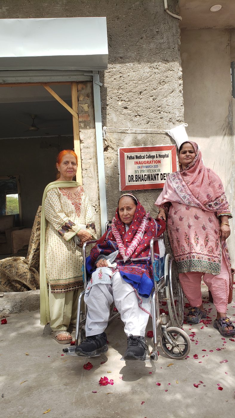 Dr. Bhagwant Devi with family and guests at the plaque